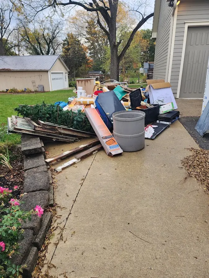 Dumpster being loaded with debris for Residential Dumpster Rental in Manhattan Beach